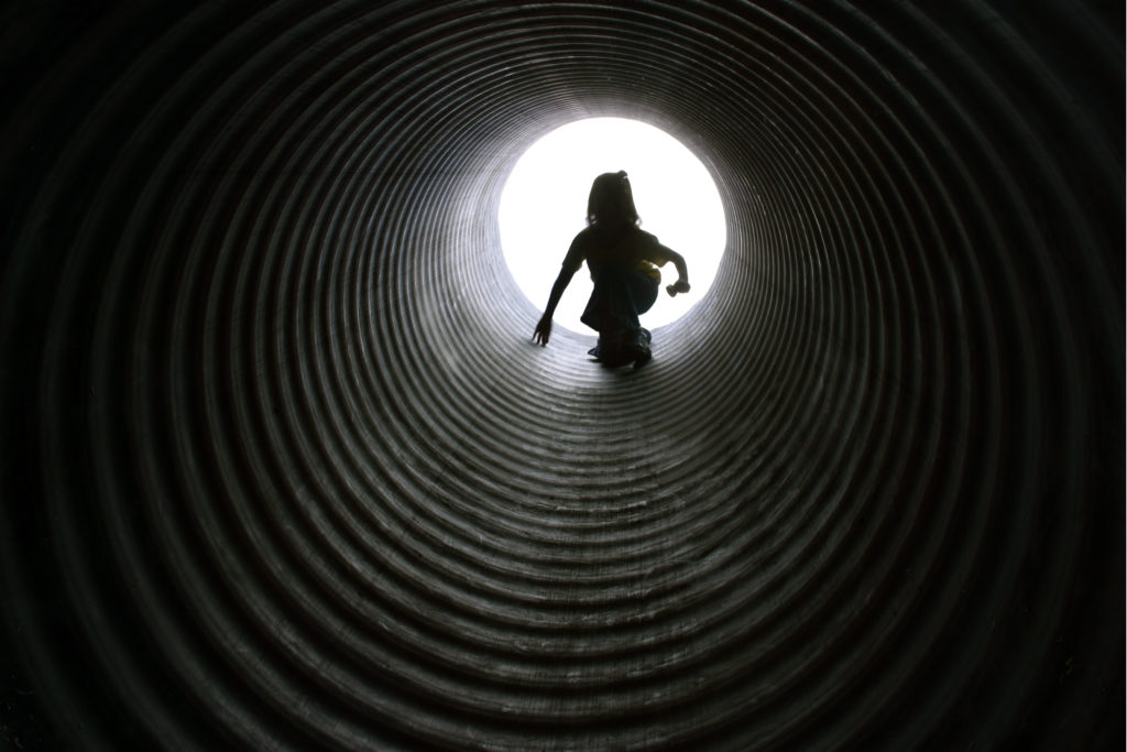 child in tunnel for childhood trauma post